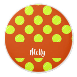 Grönt tennis boll orange mönster knopp