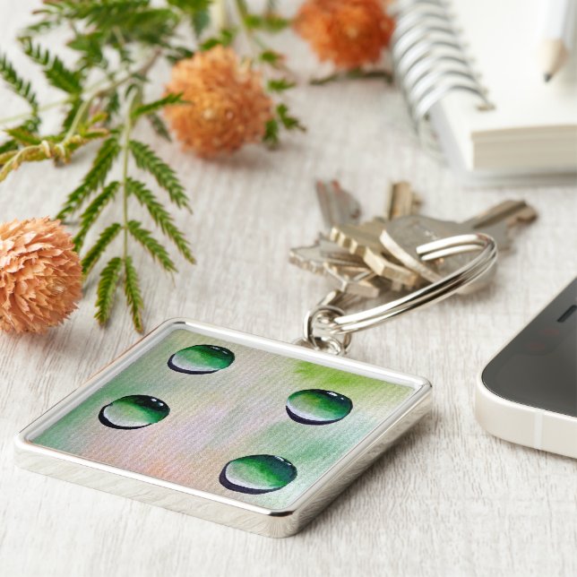 Grönt vatten droppar konst fyrkantig silverfärgad nyckelring (Sidan)