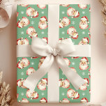 Grönt Vintage Jultomten Ansikte vattenfärg Presentpapper<br><div class="desc">Backa dina presenter i festiv beundran med vår Grönt Vintage Jultomten Ansikte Watercolor Wrapping Papper! Den här charmerande designen har nostalgiska vattenfärgbilder av Jultomten ansikte som ställs mot en livfull bakgrund, som är försedd med delikat snöflingor. Perfekt för att lägga till ett litet vintage charm till presenter i helgdag. Den...</div>