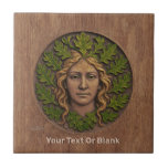 Grönt Woman - Wood Kakelplatta<br><div class="desc">En Grönt Kummel i trä med färg på ekens löv och hår. Anpassa genom att lägga till egen text. Också känd som ett folathuvud, Grönt Man/Vild Man, är ett motiv inom arkitektur och konst, ett ansikte som består av eller helt omges av löv, som oftast sprids ut från mitten av...</div>