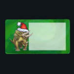 Grönten Triceratops jul Fraktsedel<br><div class="desc">Juldesignen i Parad från djurparken i Festive Triceratops ger vår roligt illustration av en triceratops som bär en röd julhatt och som står i ett snölandskap mot en blå stjärnnatt. Vår ursprungliga dinosaurikonst målades av vår begåvade barnillustrator Traci Van Wagoner. På många av våra helgdag och tillbehör till roligten hittar...</div>