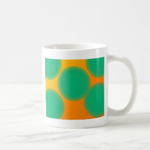 gröntens cirkel i gulaktig orange kaffemugg