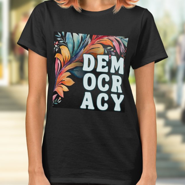 Groovy Retro Färgglad Demokratiutsaga T Shirt (A t-shirt with 'Democracy' in capital letters in a retro groovy style, on a colorful leafy backdrop)