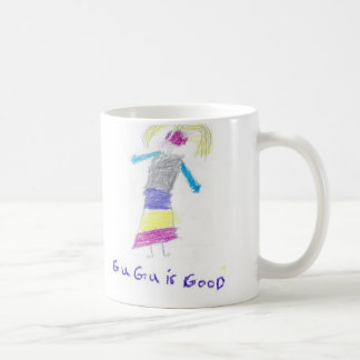 Gugu som lärer, centrerar kaffemugg