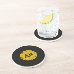 Gul monogramdesign underlägg sandsten