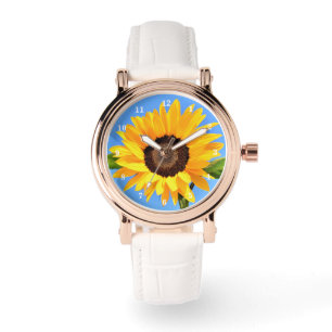 Gul solros mot solen på blå himmel - sommar armbandsur