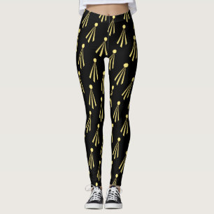 Gul solstrålemönster på svart leggings