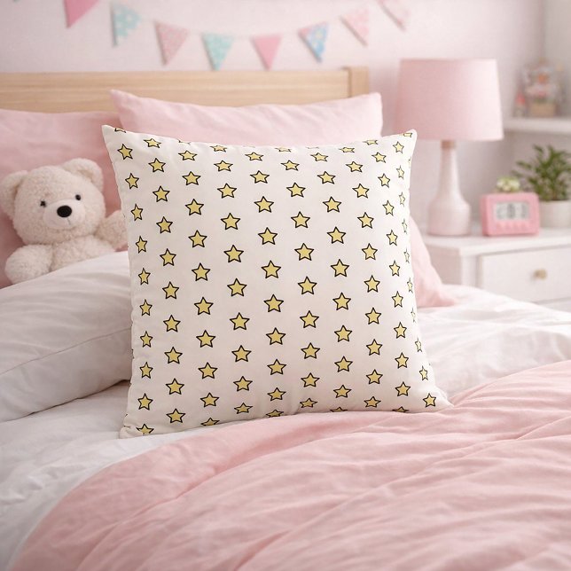 Gul stjärnmönster halvdropprepetition kudde (A throw pillow with a cute yellow and black star pattern.)