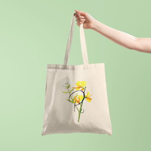 Gula akvarellblommor med din initial på ena sidan tygkasse