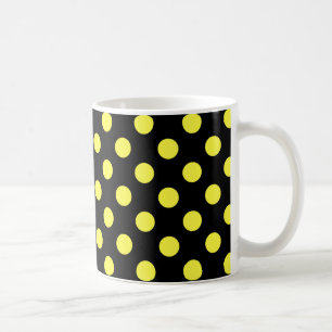 Gula prickar på svart bakgrund kaffemugg