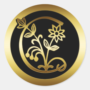 GULD- BLOM- MONOGRAMBREV C RUNT KLISTERMÄRKE