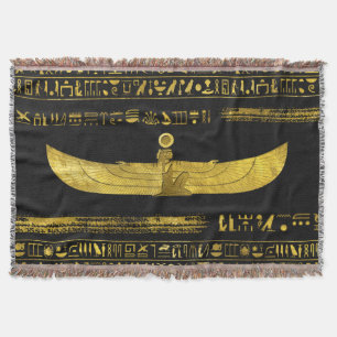 Guld- egyptisk gudprydnad på svart läder filt