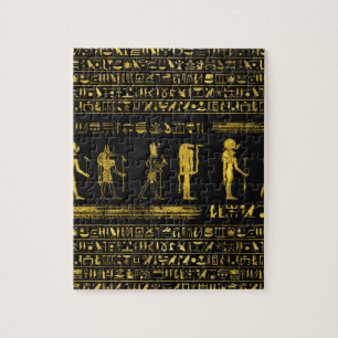 Guld- egyptiska gudar och hieroglyphics på läder pussel