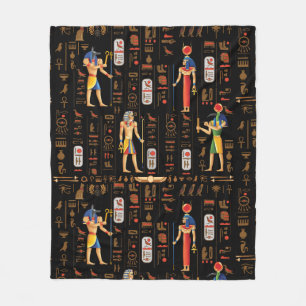 Guld-egyptiska hieroglyfer och gudom på svart fleecefilt