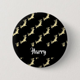 Guld fladdermöss på svart knapp