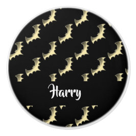 Guld fladdermöss på svart knopp