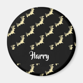 Guld fladdermöss på svart magnet