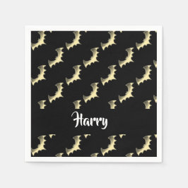 Guld fladdermöss på svart pappersservett