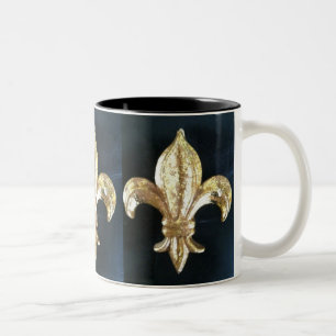 GULD- FLEUR DE LIS PÅ SVARTTRYCK Två-Tonad MUGG
