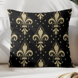 Guld fleur-de-lis sömlöst mönster på svart kudde