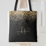 Guld Glitter Glam Monogram Namn Tygkasse<br><div class="desc">Glam Guld Glitter Elegant Monogram Tote Bag. Anpassa enkelt trendigets chic till säcksdesignen med elegant guld mousserande glitter mot svart bakgrund. Designen har ditt handskrivna skriptmonogram med söt-snurrar och ditt namn.</div>