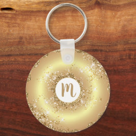 Guld glitter-munnötsmonogramskript med gigantisk l nyckelring