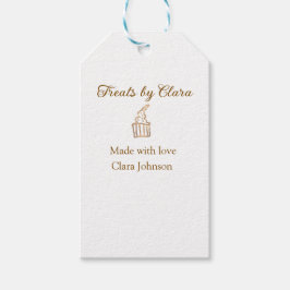 Guld gnistra behandlar bakverk som tillverkats med presentetikett