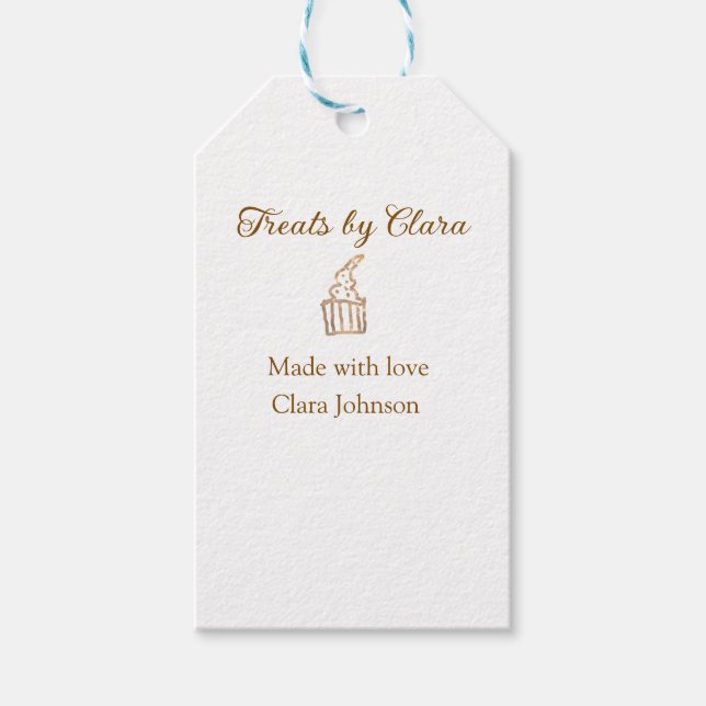 Guld gnistra behandlar bakverk som tillverkats med presentetikett (Framsidan)