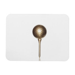 Guld- golfboll och utslagsplats magnet