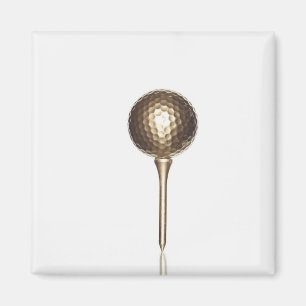Guld- golfboll och utslagsplats magnet