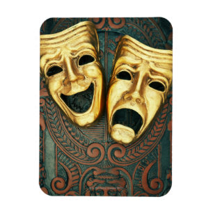 Guld- komedi och tragedin maskerar på mönstrat magnet