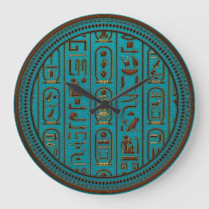 Guld- läderhieroglyphs som utföra i relief på stor klocka