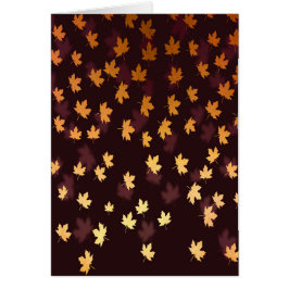 Guld lönnlöv på mörkröd hälsningskort
