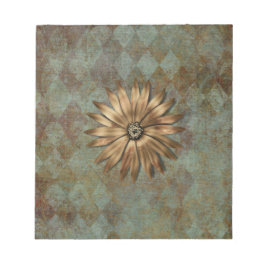 Guld metallblomma på Grönt Anteckningsblock