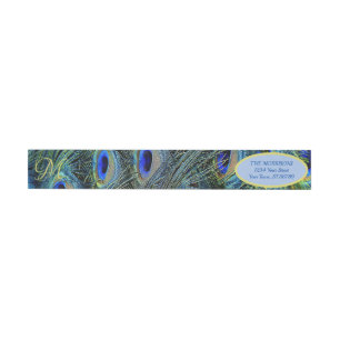 Guld Monogram Peacock Feathers figurerar runt etik Etikettband