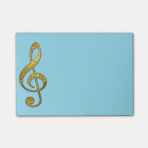 "guld-" noterar den klibbiga trebleklaven vadderar post-it block