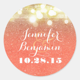 Guld- och persikaglitter stränger att gifta sig runt klistermärke