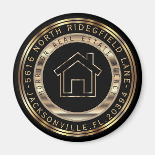 Guld- och svartmetallfastighetsmäklaredesign magnet