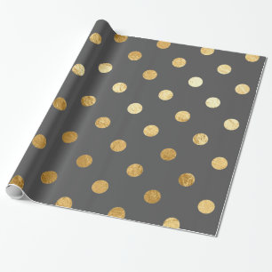Guld omkullkastar polka dotsmönster som slår in presentpapper