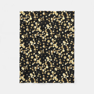 Guld polka dots mot svart bakgrund. fleecefilt