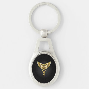 Guld Polygonal Symbol Caduceus Ovalt Silverfärgad Nyckelring