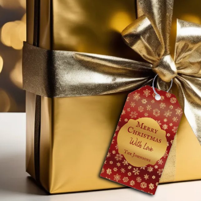 Guld snöflingor om mörk-röda bakgrundskorridorer presentetikett (Skapare uppladdad)