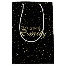 Guld-ton glitter och gnistor på svart