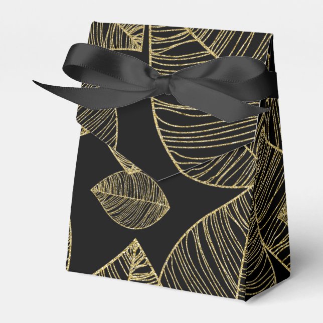 Gulda blad på svarta eleganta presentlådor (Framsidan Sidan)