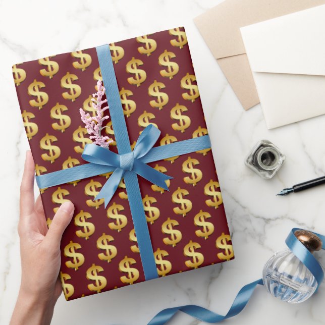 Gulda dollarsymboler på vinrött presentpapper (Gifting)