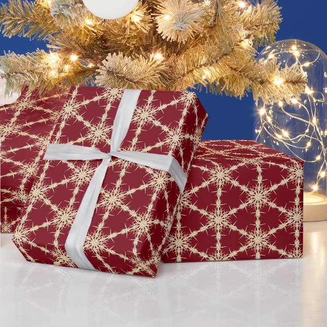 Gulda snöflingor på rött presentpapper (Helgdagar)