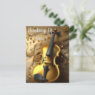 Guldantad violin på gyllene musiksladdar, vykort