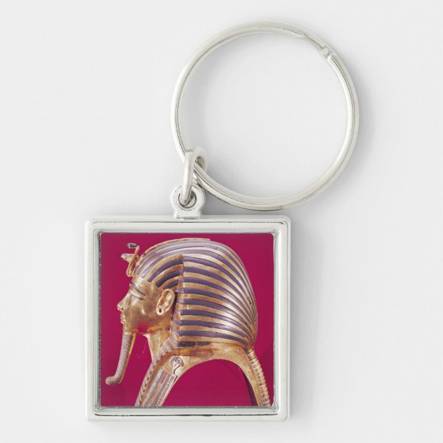 Guldet maskerar fyrkantig silverfärgad nyckelring (Framsidan)