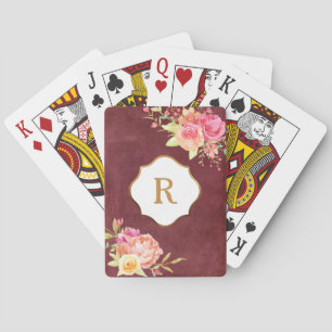 Guldmonogram & blommor på gammal röd textur casinokort