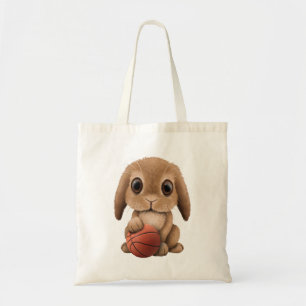 Gullig babykanin som leker med basket tygkasse